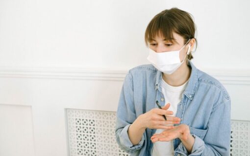 Employer wearing a face mask