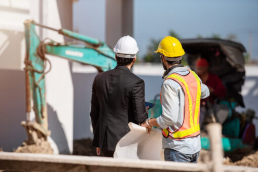 Construction workers on a job site where workplace safety and drug testing rules are enforced