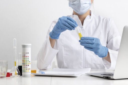 Urinalysis test tube and multi-panel test strip container used for workplace drug testing